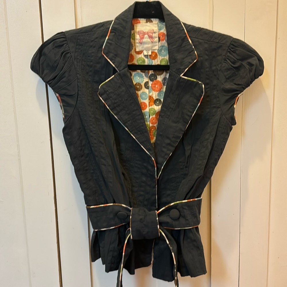 Beautiful Anthropologie Bow and Arrow peplum top!